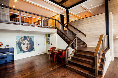 Large transitional wooden l-shaped staircase photo in Toronto with wooden risers