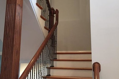 Inspiration for a mid-sized timeless painted l-shaped staircase remodel in Louisville with painted risers