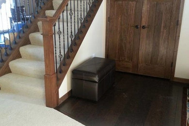 Medium sized traditional carpeted straight staircase in Minneapolis with carpeted risers.