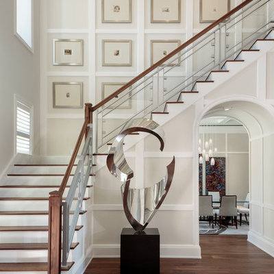 Large transitional wooden l-shaped mixed material railing staircase photo in Miami with painted risers