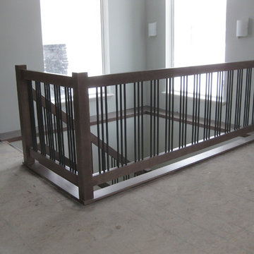 New Construction - Contemporary Maple Railings with Metal Spindles