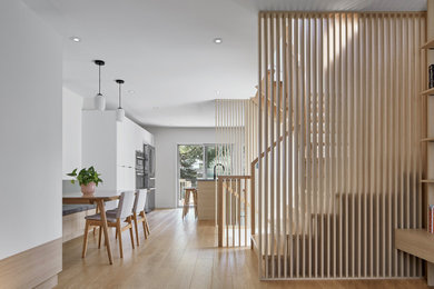 Inspiration for a small scandinavian wooden u-shaped open and wood railing staircase remodel in Toronto