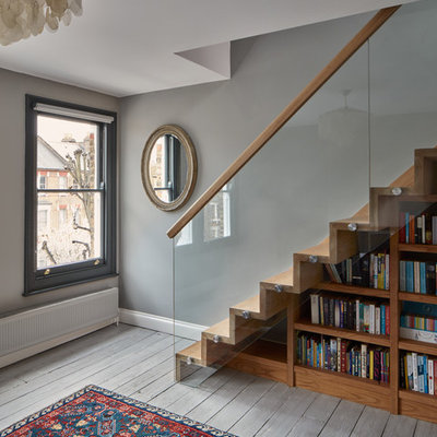 Staircase - contemporary wooden staircase idea in London with wooden risers