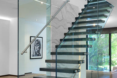 Trendy floating open and glass railing staircase photo in Toronto
