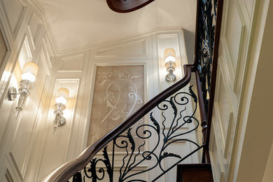 Example of a large transitional wooden curved staircase design in New York with wooden risers