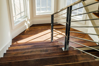 Mid-sized trendy wooden u-shaped metal railing staircase photo in Nashville with painted risers