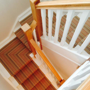 Oak posts & rails, white spindles & treads and striped runner