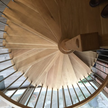 Spiral Staircase featuring beautiful American White Oak treads with stainless st