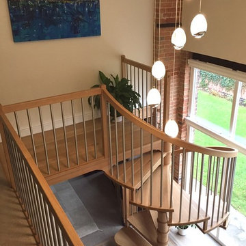 Spiral Staircase featuring beautiful American White Oak treads with stainless st