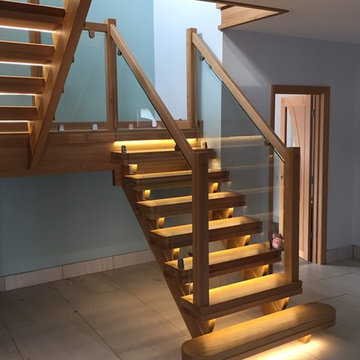 Oak & Glass Staircase with LED strip lighting inset into the treads