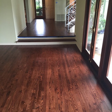 Oak strip flooring in entry and steps with rosewood stain