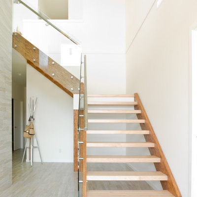 Mid-sized minimalist wooden l-shaped open and glass railing staircase photo in Vancouver
