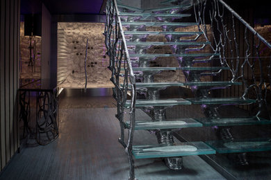 Medium sized contemporary glass l-shaped staircase in Essex with open risers.