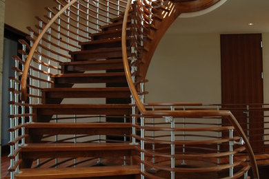 Inspiration for a modern wooden open staircase remodel in DC Metro