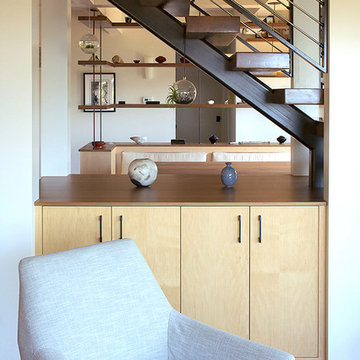 Open stairs with cabinet below