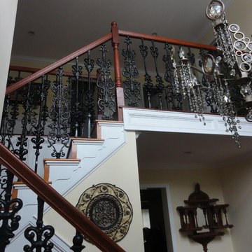 Ornamental iron railing with wood handrail