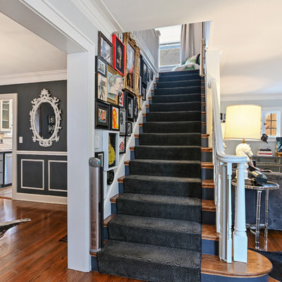 Inspiration for an eclectic wooden straight wood railing staircase remodel in Kansas City with painted risers