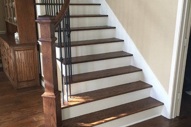 Mid-sized elegant wooden straight metal railing staircase photo in Dallas with painted risers