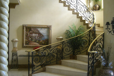 Photo of a large tiled curved staircase in Dallas with tiled risers.