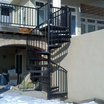 Outside iron spiral staircase to back porch