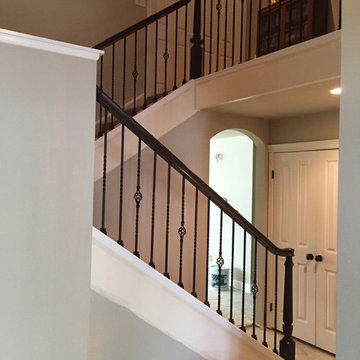Over the post wood railing system w/ iron balusters