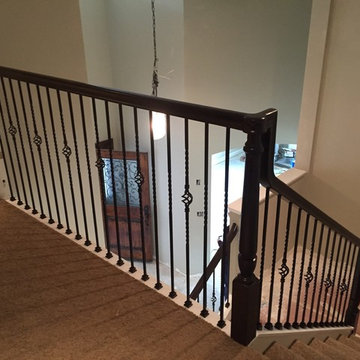 Over the post wood railing system w/ iron balusters