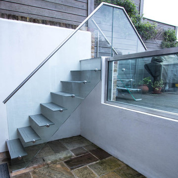 Painted mild steel construction open string-riser external access staircase