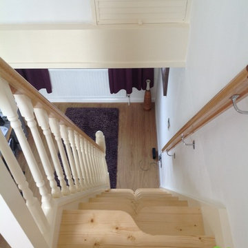White painted SpaceSaver staircase with pine accents