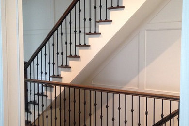 Design ideas for a large classic wood straight staircase in Toronto with metal risers.