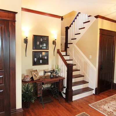 Mid-sized cottage wooden u-shaped staircase photo in Other with painted risers