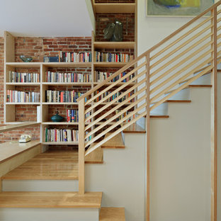 Staircase - transitional wooden l-shaped wood railing staircase idea in New York with painted risers