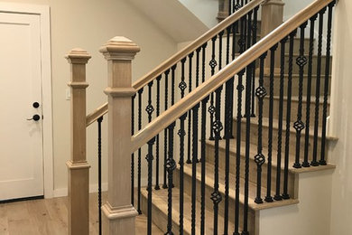 Mid-sized wooden l-shaped metal railing staircase photo in San Francisco with wooden risers