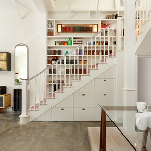 Contemporary l-shaped staircase in Other with wood railing.