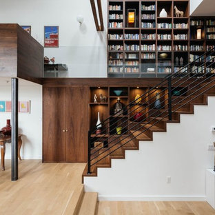 Inspiration for a mid-sized contemporary wooden straight staircase remodel in New York with wooden risers