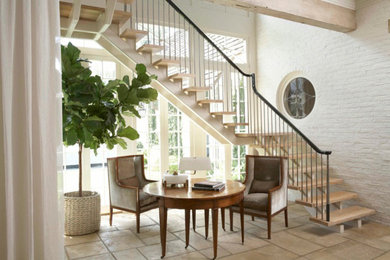 Example of a mid-sized transitional wooden l-shaped open staircase design in Miami
