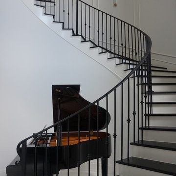 Piano by the wrought iron staircase