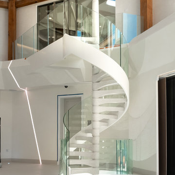 Poolside concrete spiral staircase