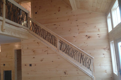 Example of an arts and crafts staircase design in Charlotte