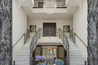 Inspiration for an expansive classic curved staircase in London.