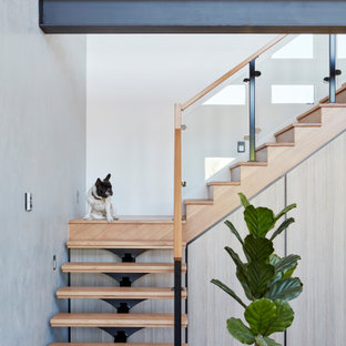 Design ideas for a contemporary wood l-shaped staircase in Melbourne with open risers and mixed railing.