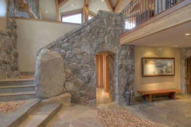 Example of a large mountain style tile curved staircase design in Sacramento
