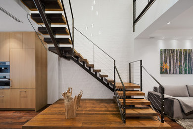 Staircase - large contemporary wooden u-shaped open staircase idea in New York