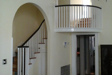 Inspiration for a large mediterranean wooden l-shaped staircase remodel in Tampa