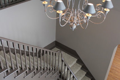 Inspiration for a large contemporary curved staircase remodel in Calgary