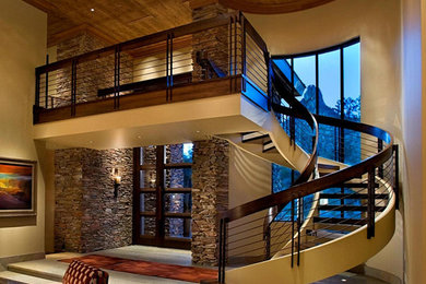 Design ideas for an expansive contemporary wood spiral staircase in Sacramento with open risers.