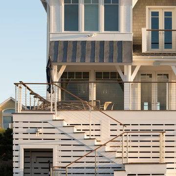 Rear deck stair leading to outdoor shower