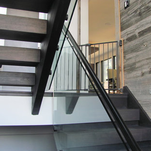 Inspiration for a mid-sized contemporary wooden u-shaped open and glass railing staircase remodel in Toronto
