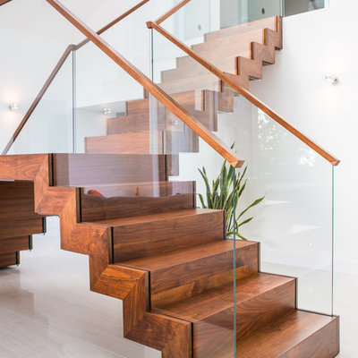 Inspiration for a contemporary wooden l-shaped staircase remodel in Other with wooden risers