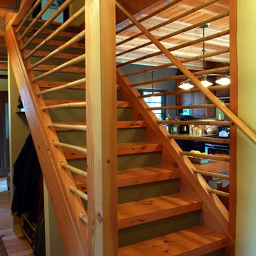 Reclaimed lumber treads and stair jacks with bamboo accents