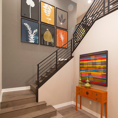 Staircase - mid-sized contemporary wooden l-shaped metal railing staircase idea in Los Angeles with wooden risers